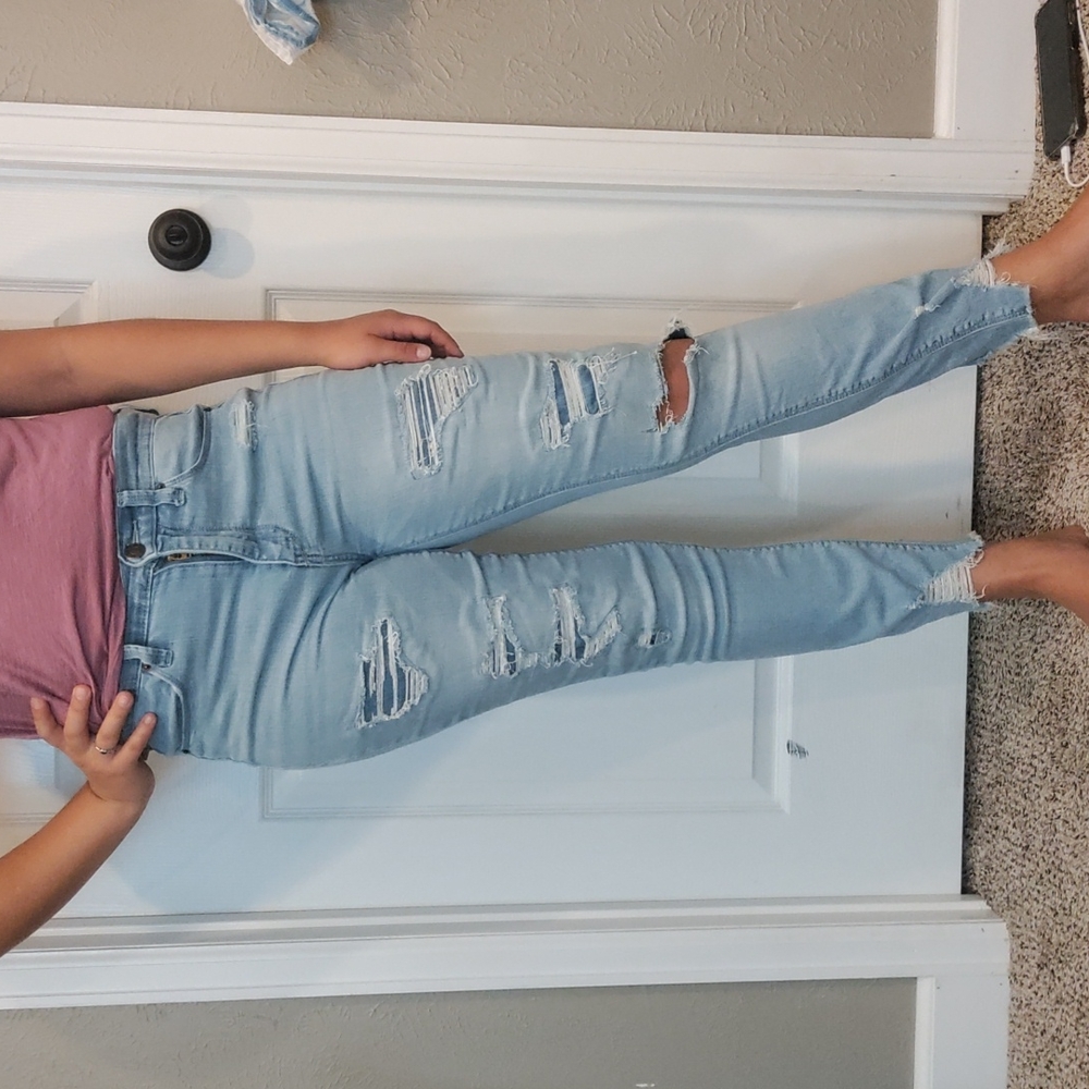 Distressed blue jeans with some patches